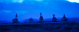 Military navy ships in a sea bay at sunset time. Selective focus
