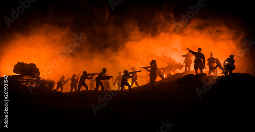 War Concept. Military silhouettes fighting scene on war fog sky background 