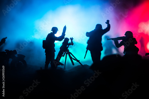 War Concept. Military silhouettes fighting scene on war fog sky background,