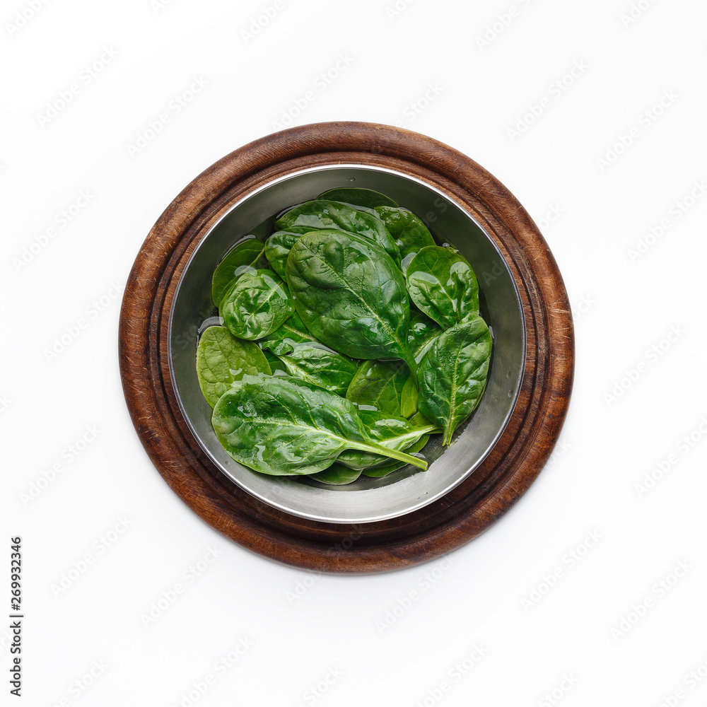 Fresh Basil Leaves In Bowl On Wooden Board Fresh Basil Leaves In Bowl On Wooden Board