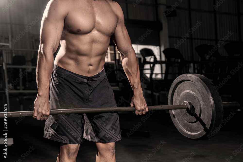 Close up of hands Handsome strong athletic men pumping up muscles workout barbell curl bodybuilding concept background - muscular bodybuilder men doing exercises in dark gym . Close up of hands Handsome strong athletic men pumping up muscles workout barbell curl bodybuilding concept background - muscular bodybuilder men doing exercises in dark gym .