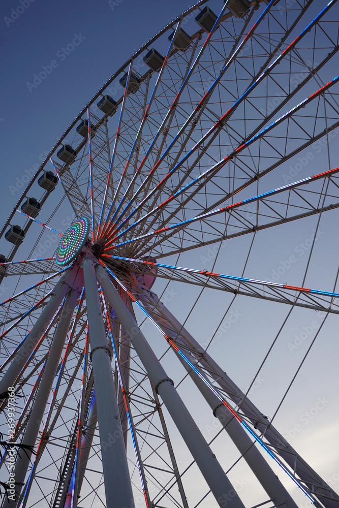 Low angle view of a Ferris Wheel at dusk