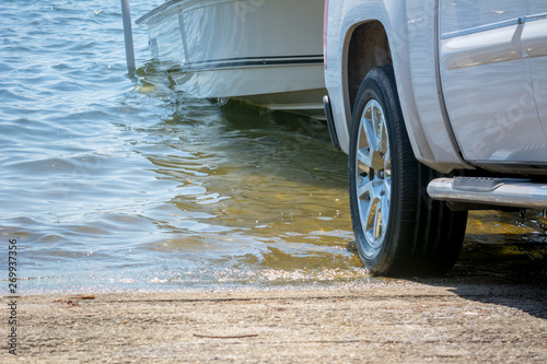 Close Up of the Rear of a Truck Recovering a Boat from the Sea