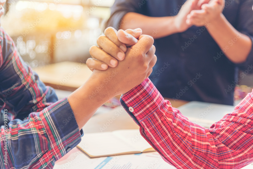 Team Business Partners Giving Fist Bump after complete a deal. Successful Teamwork Partnership in an office. Businessman with hands together. industry business concept.