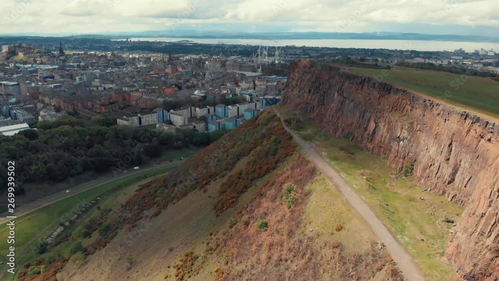 Golden hour shot of Holyrood Park, Arthurs Seat in Edinburgh, Scotland, UK. Hills in Holyrood Park. Perfect destination to run and hike.