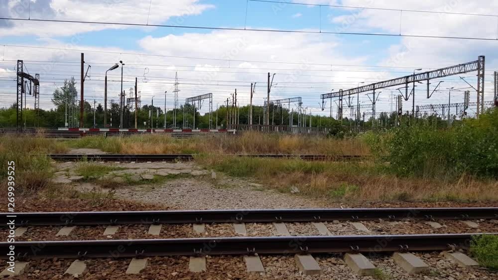 Panned shot of electrified rail tracks. Railroad intersection. Panned shot of electrified rail tracks. Railroad intersection.