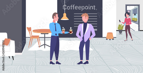 businessman giving coffee cup to his colleague businessmen office workers having break for drink at work business communication concept modern coffeepoint interior flat full length horizontal