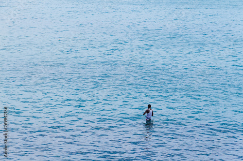 Man alone in the Sea fishing