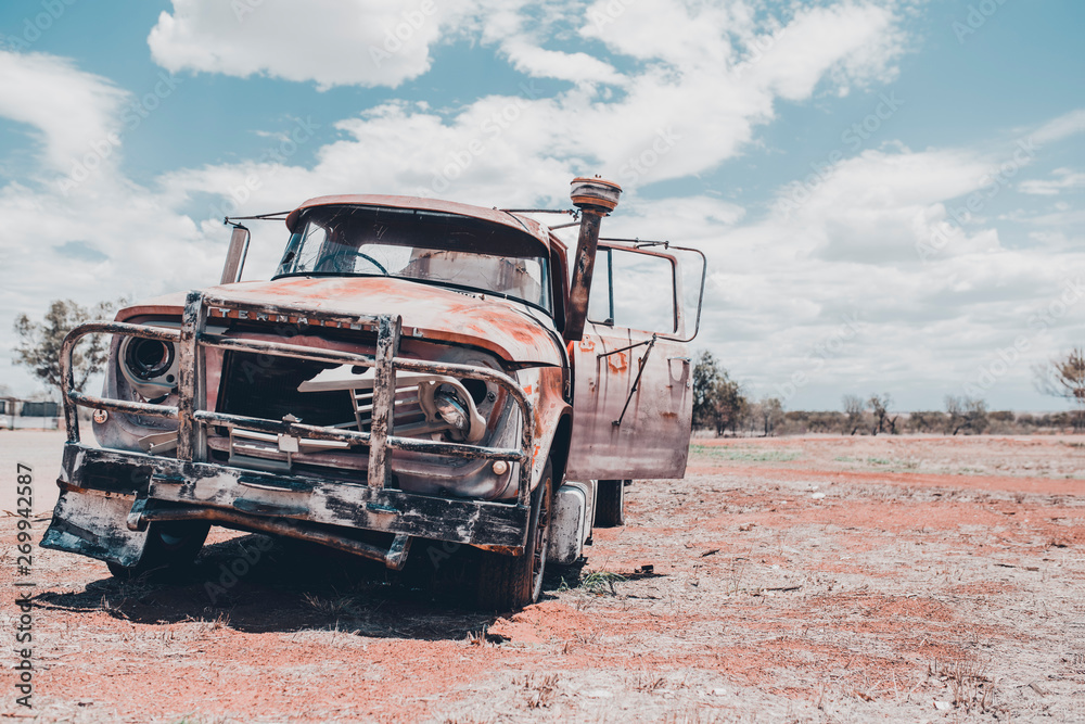 Abandoned and wrecked car in Australia waiting to be towed