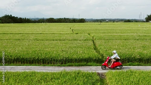 A young man riding a chopper on a countryside road. Beautiful mountain road. travel on motorbike.