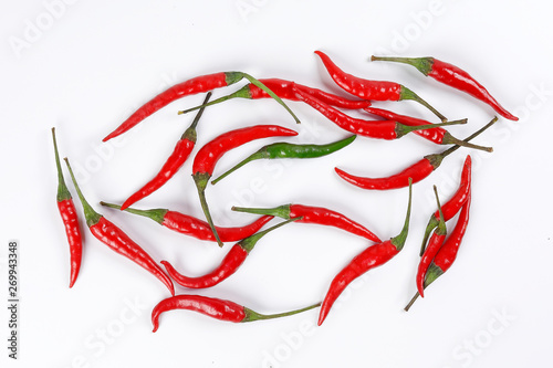 Fresh birds eye red chilli scattered isolated unique green chilli top view on white background