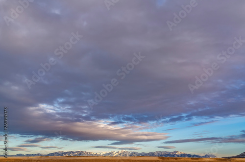 Panoramic view of a majestic mountain range covered with sharp white snow