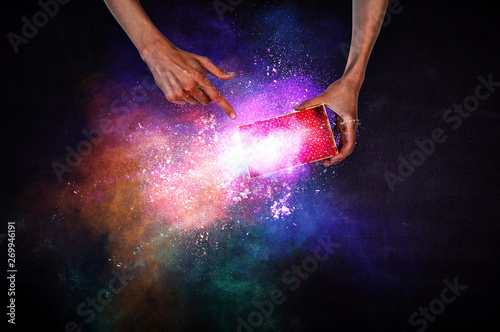 Man s hands holding a small magic paper box, mixed media © Sergey Nivens