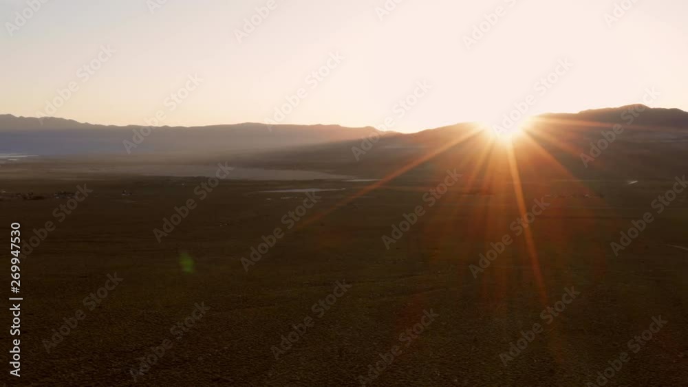 Sunrise at a valley near Lone Pine in the Sierra Nevada. Aerial shot.