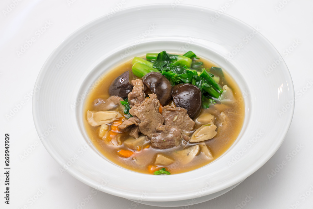 Fried noodle with beef , shiitake and chinese kale in gravy