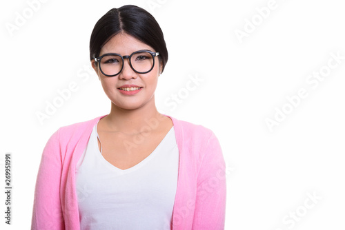 Studio Portrait Of Young Asian Woman Isolated Against White Background