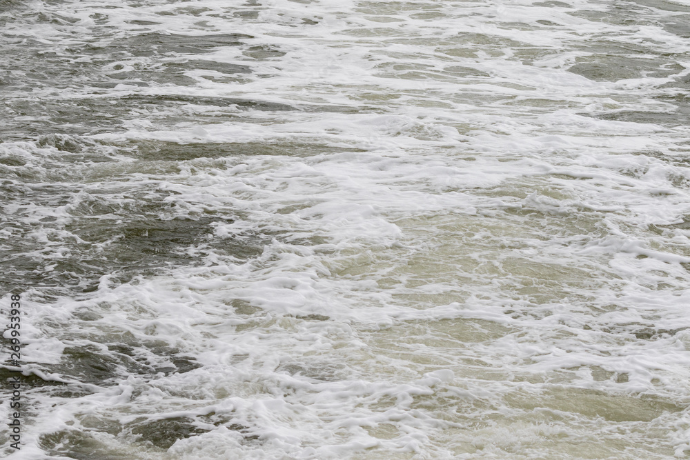 Small waves behind fast driving boat on the north sea Small waves behind fast driving boat on the north sea