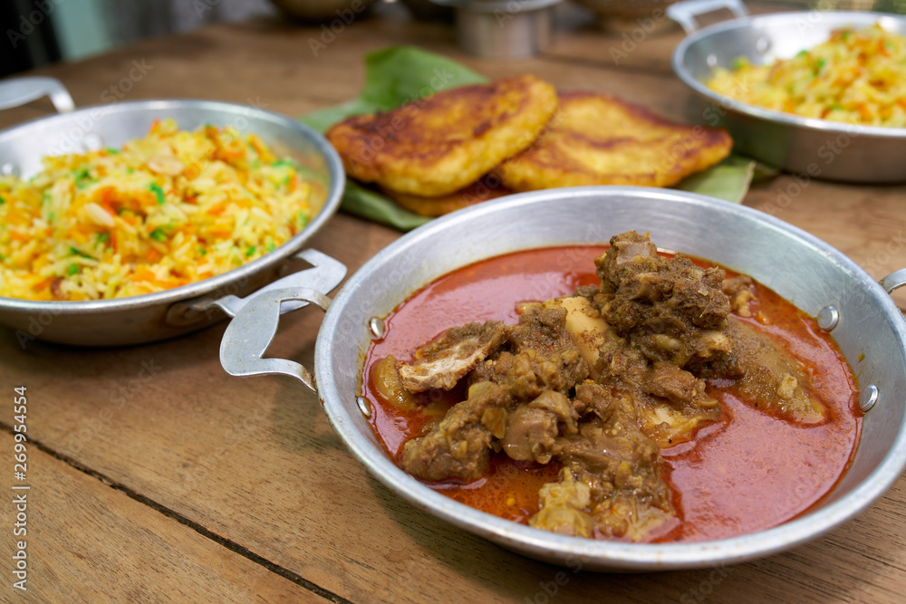 Red Goat Curry on wood table