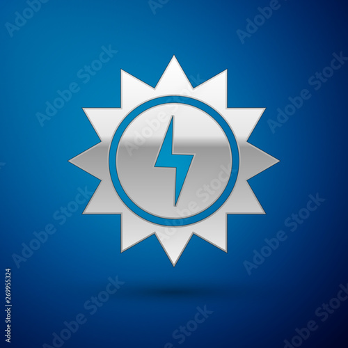 Silver Solar energy panel icon isolated on blue background. Sun with lightning symbol. Vector Illustration