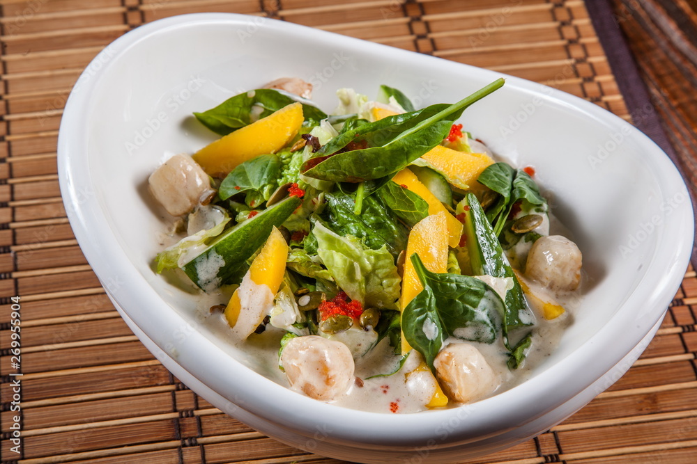 Tasty sea scallops salad with sauce Tasty sea scallops salad with sauce