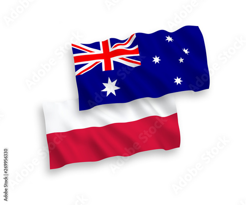National vector fabric wave flags of Australia and Poland isolated on white background. 1 to 2 proportion.