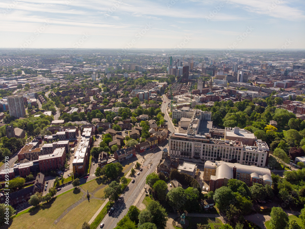 Aerial photo of the town known as Headingley in Leeds West Yorkshire, you can see the Leeds university in the background and the Leeds City Centre taken with a drone on a beautiful sunny day.