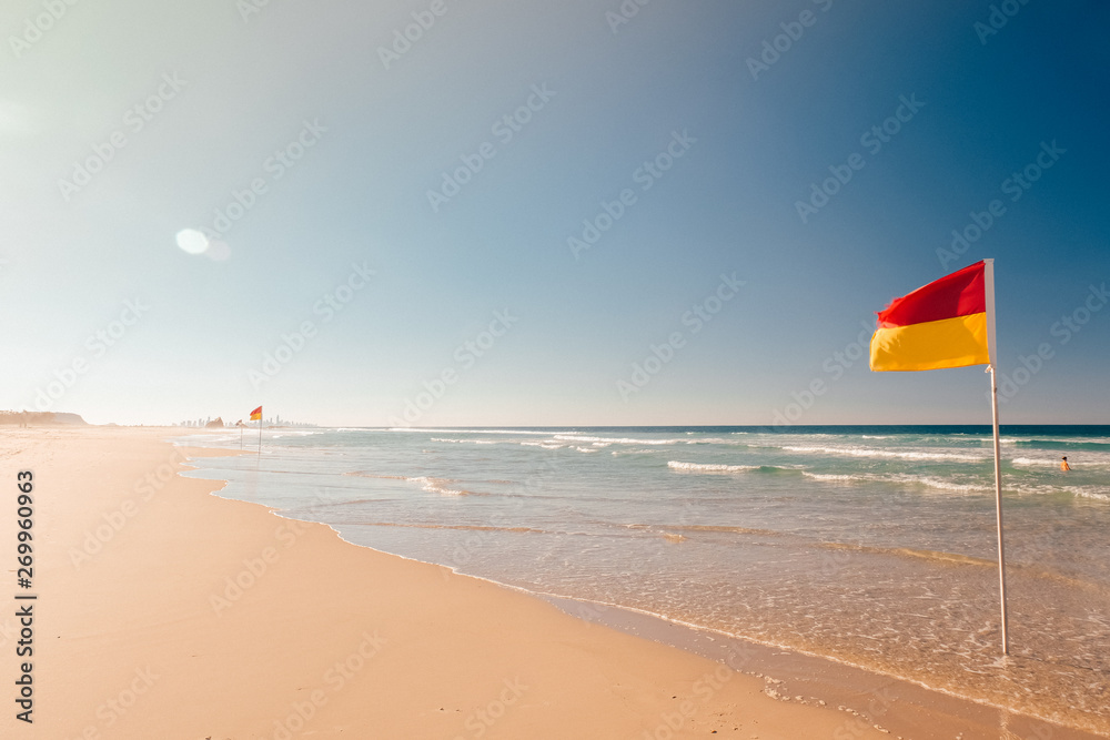 Red Yellow flag on the beach