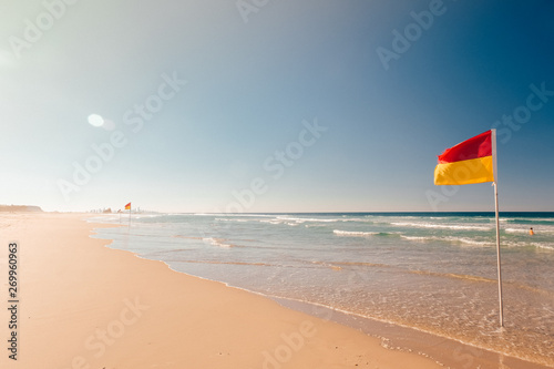 Red Yellow flag on the beach