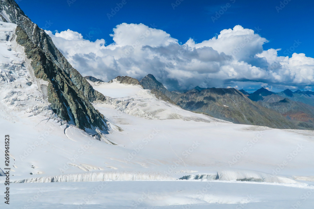 View to the Mensu glacier from the Berelskoe sedlo mountain pass. Belukha Mountain area. Altai, Russia
