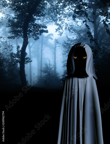 Spooky monster in hooded cloak in misty forest