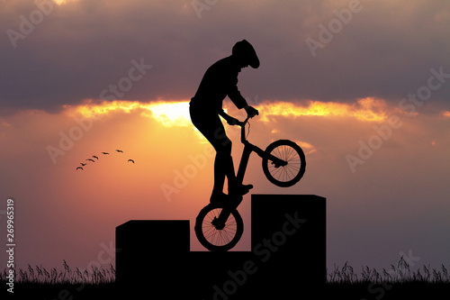 bike trial silhouette at sunset