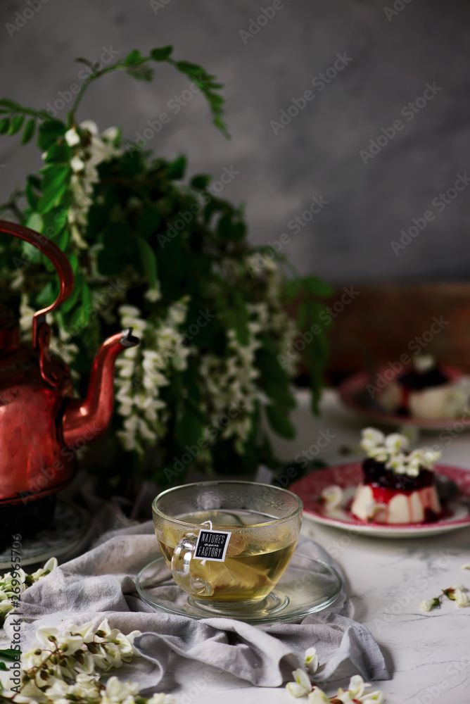 pannacotta with acacia flowers and cherry sauce.