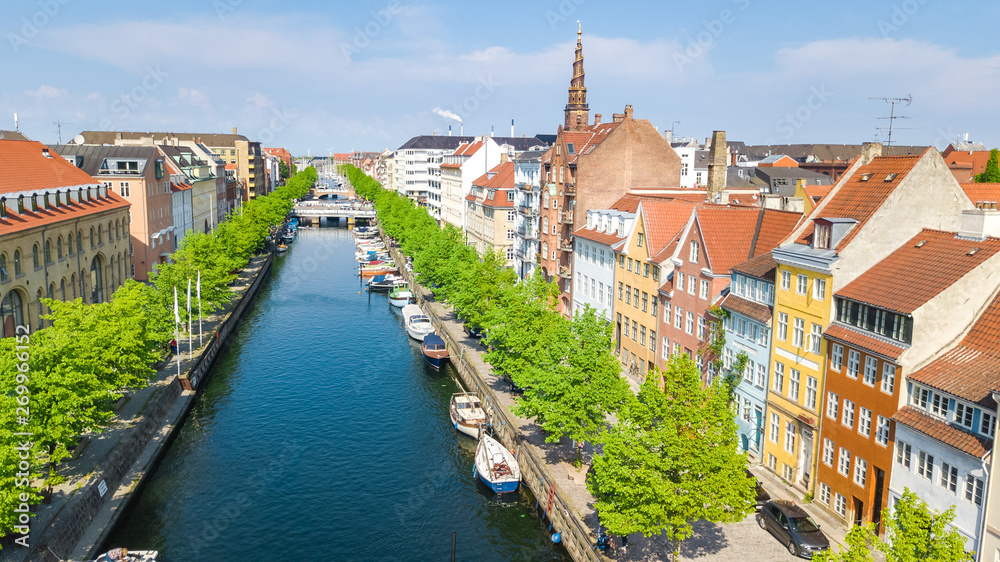 Beautiful aerial view of Copenhagen skyline from above, Nyhavn historical pier port and canal with color buildings and boats in the old town of Copenhagen, Denmark Beautiful aerial view of Copenhagen skyline from above, Nyhavn historical pier port and canal with color buildings and boats in the old town of Copenhagen, Denmark