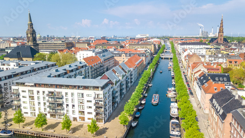 Beautiful aerial view of Copenhagen skyline from above, Nyhavn historical pier port and canal with color buildings and boats in the old town of Copenhagen, Denmark