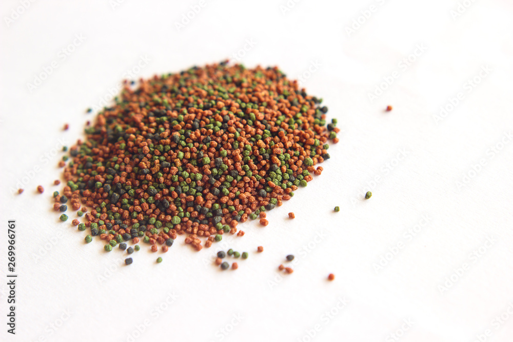 fish feed isolated on white background fish feed isolated on white background