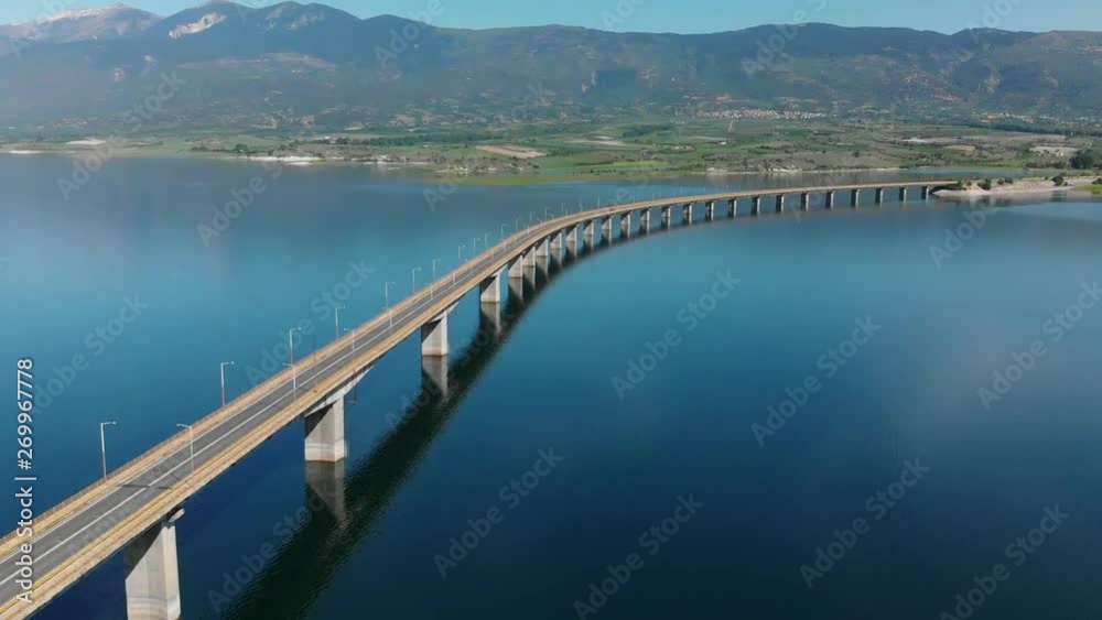 Techniti Limni Polifitou- Bridge over Polifitou Lake in Greece. Aerial tilting down.