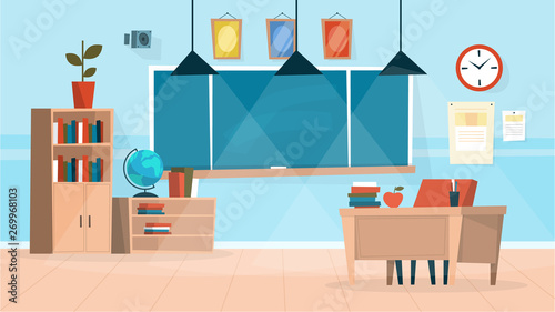 Classroom interior. Chalkboard and a teacher desk
