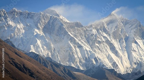View of the mount Everest in Nepal. Some clouds but sunny photo