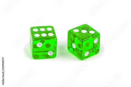 Two green glass dice isolated on white background. Six and three with a shadow.