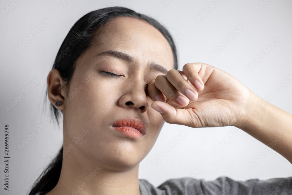 Woman suffering from strong eye pain. Woman suffering from strong eye pain.