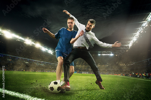 Office man as a soccer or football player at the stadium Fotobehang