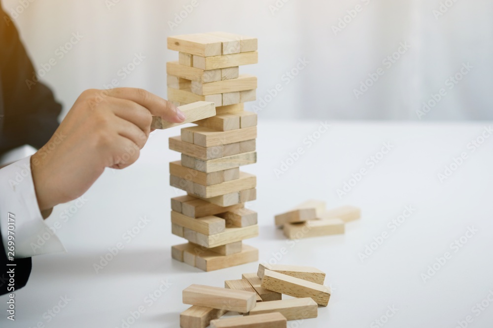 .Planning risk and strategy in businessman gambling placing wooden block.Business concept for growth success proces .Planning risk and strategy in businessman gambling placing wooden block.Business concept for growth success proces