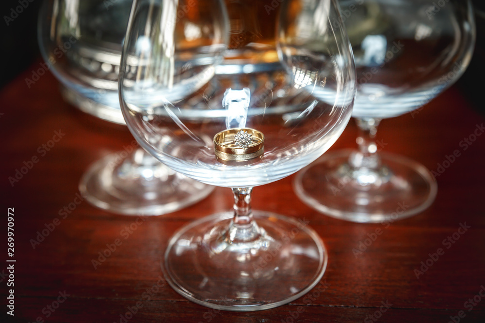 Brandy glass with a wedding ring inside Brandy glass with a wedding ring inside