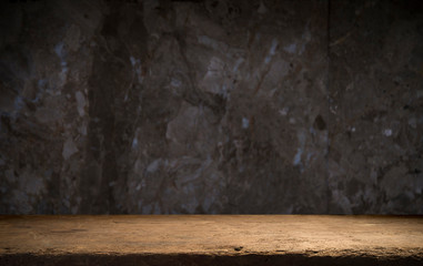 Old wooden table with brick background dark