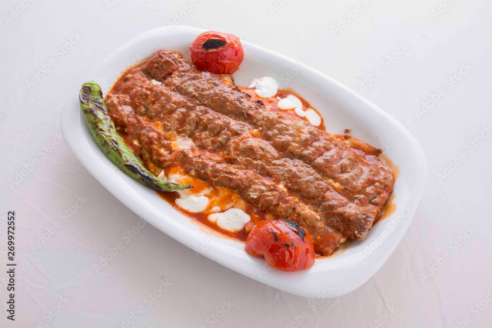 Turkish kebab with tomato sauce and yoghurt