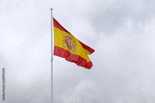 Flag of Spain against cloudy sky