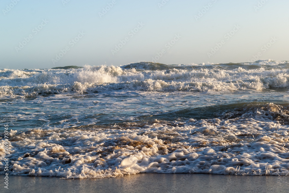 A close view of the wind blown waters of the stormy  Ionian Sea near a sandy beach of Corfu Island, Greece. 