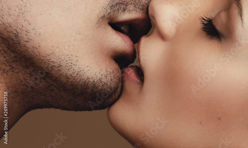 Romantic young couple kissing photo