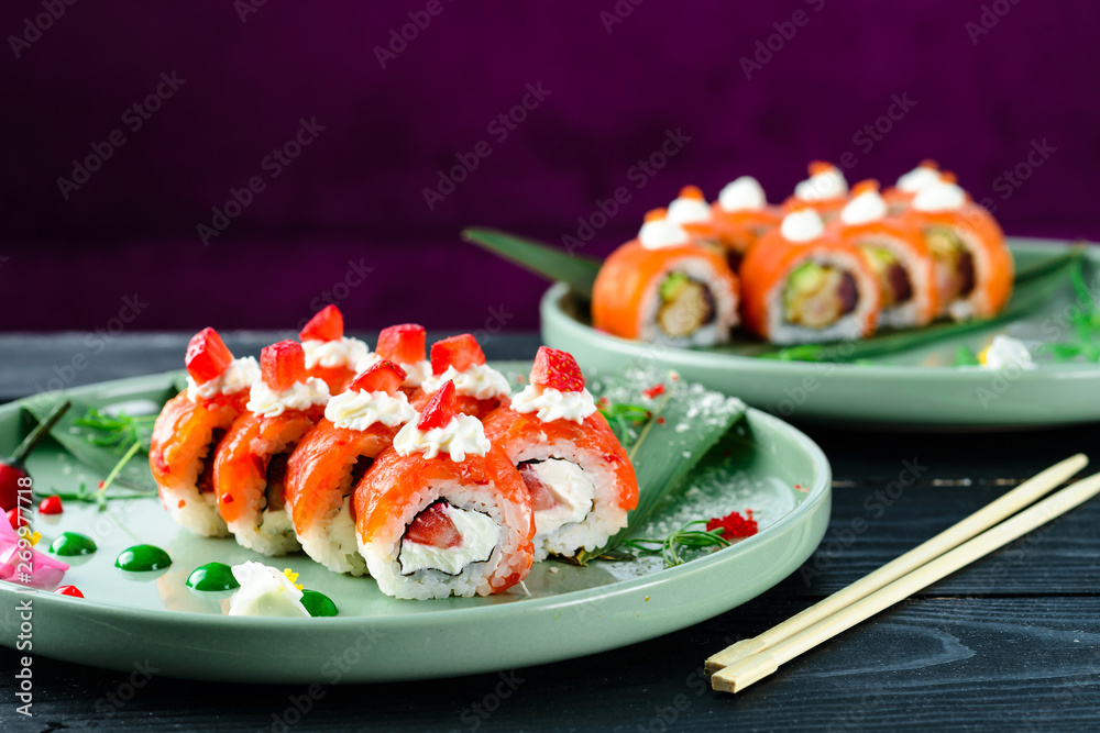 new trend close-up Philadelphia roll sushi with salmon, strawberry,  avocado, cream cheese Stock Photo | Adobe Stock