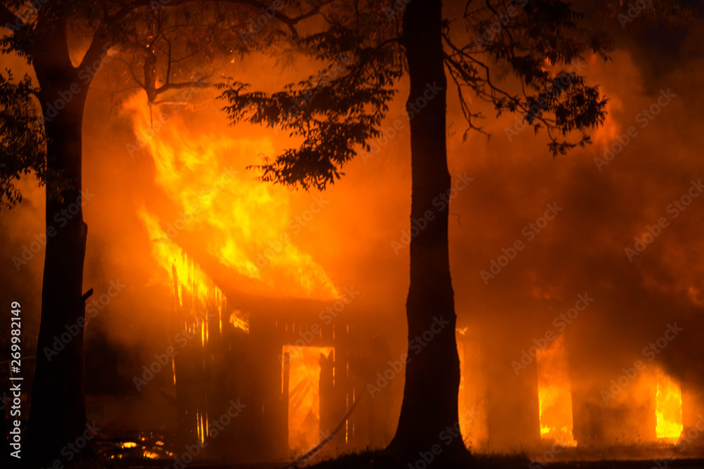 background of a house fire in the forest. natural disasters